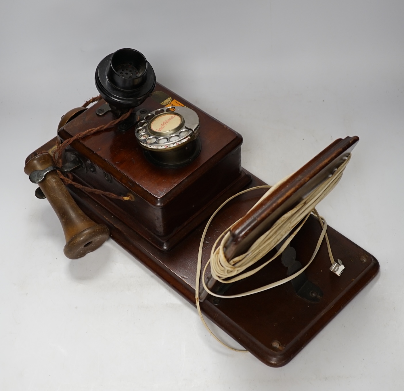 An early 20th century Hotline wall mounted telephone, 47cm long. Condition - fair